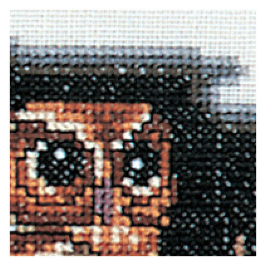 cross stitch close up  of owl on a dark background