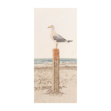 Seagull perched on a wooden post with a beach scene cross stitch