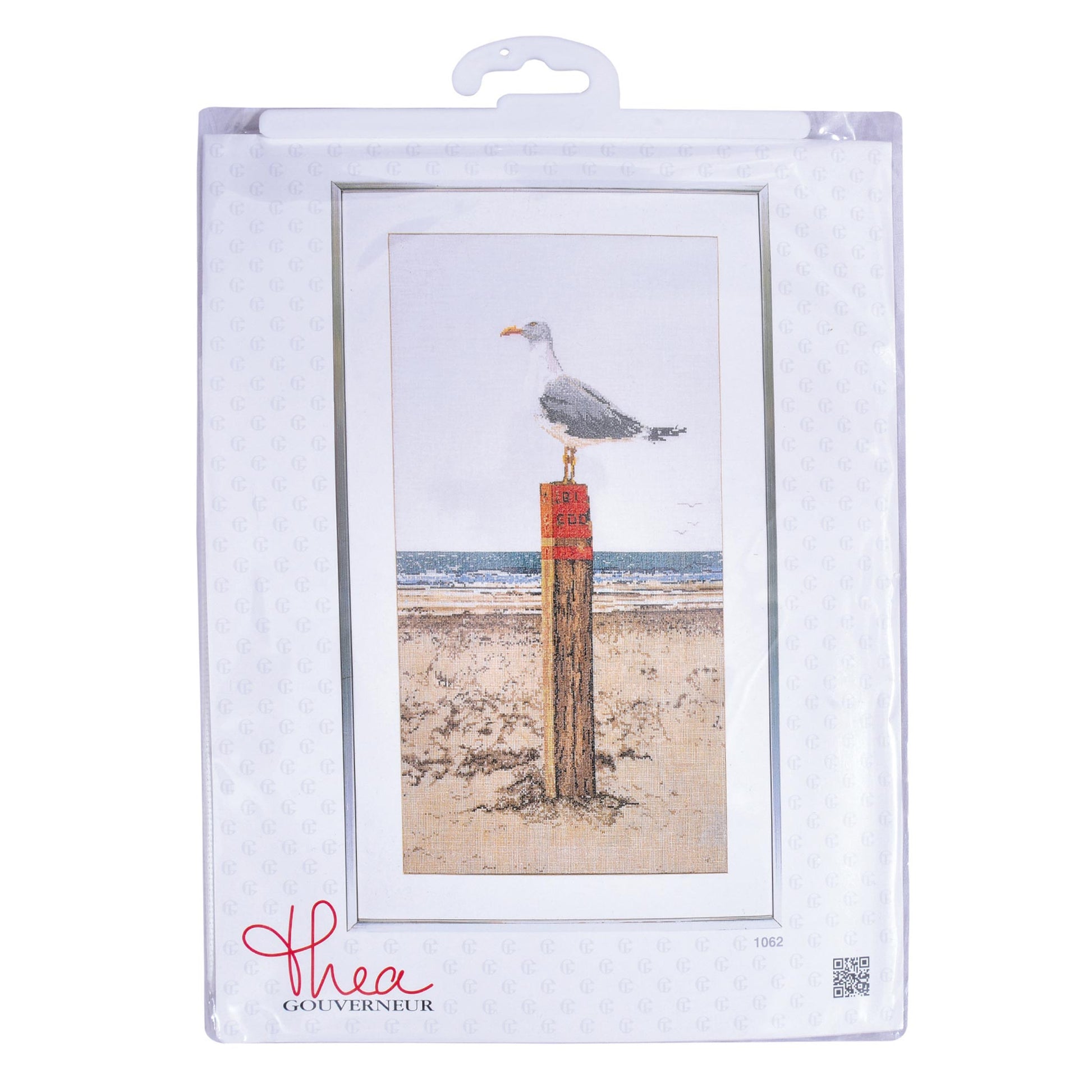 Packaged cross stitch kitof a seagull on a post with a beach scene, featuring the brand 'Thea Gouverneur'.