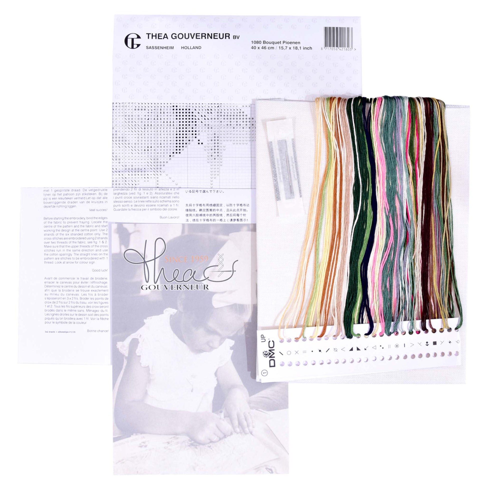 Embroidery kit with pattern and chart, needlework fabric, and threads on a white background