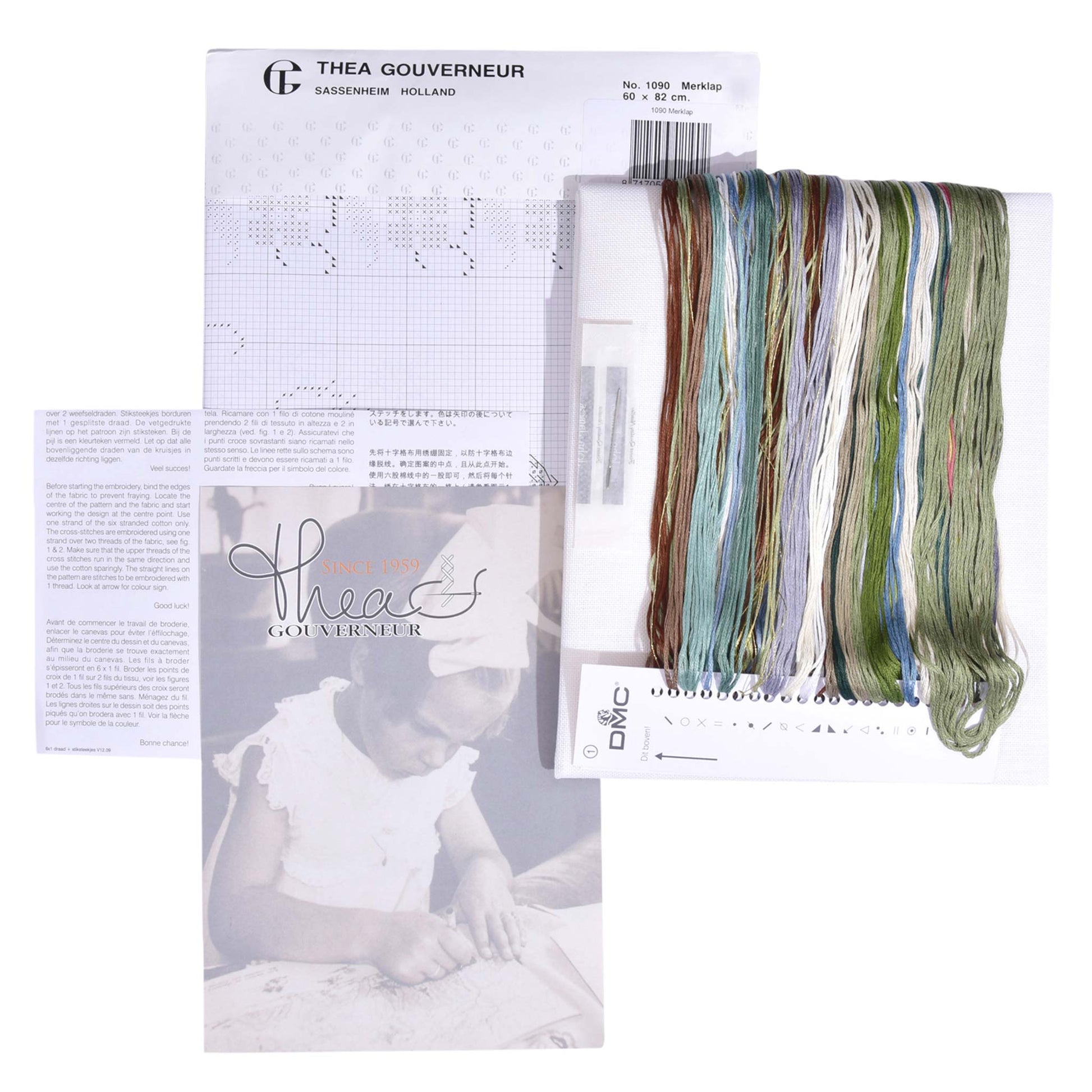 Embroidery kit with pattern and chart, needlework fabric, and threads on the floss organizer.