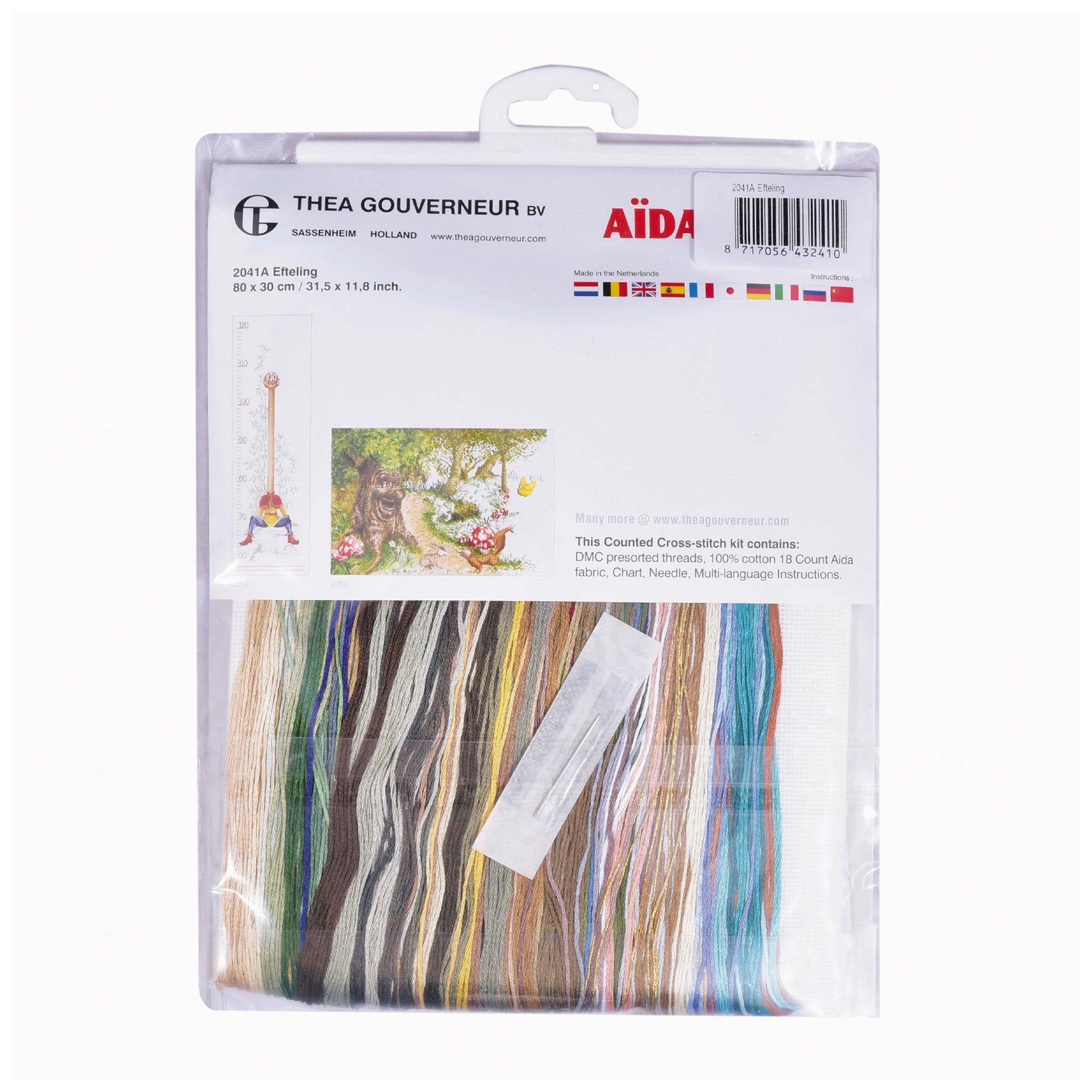 Cross stitch kit packaging with colorful DMC threads, needlework fabric and brand labels on a white background