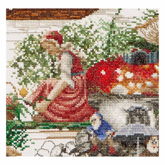 Cross stitch scene with fairy and two gnomes near a mushroom house, Efteling park in the Netherlands