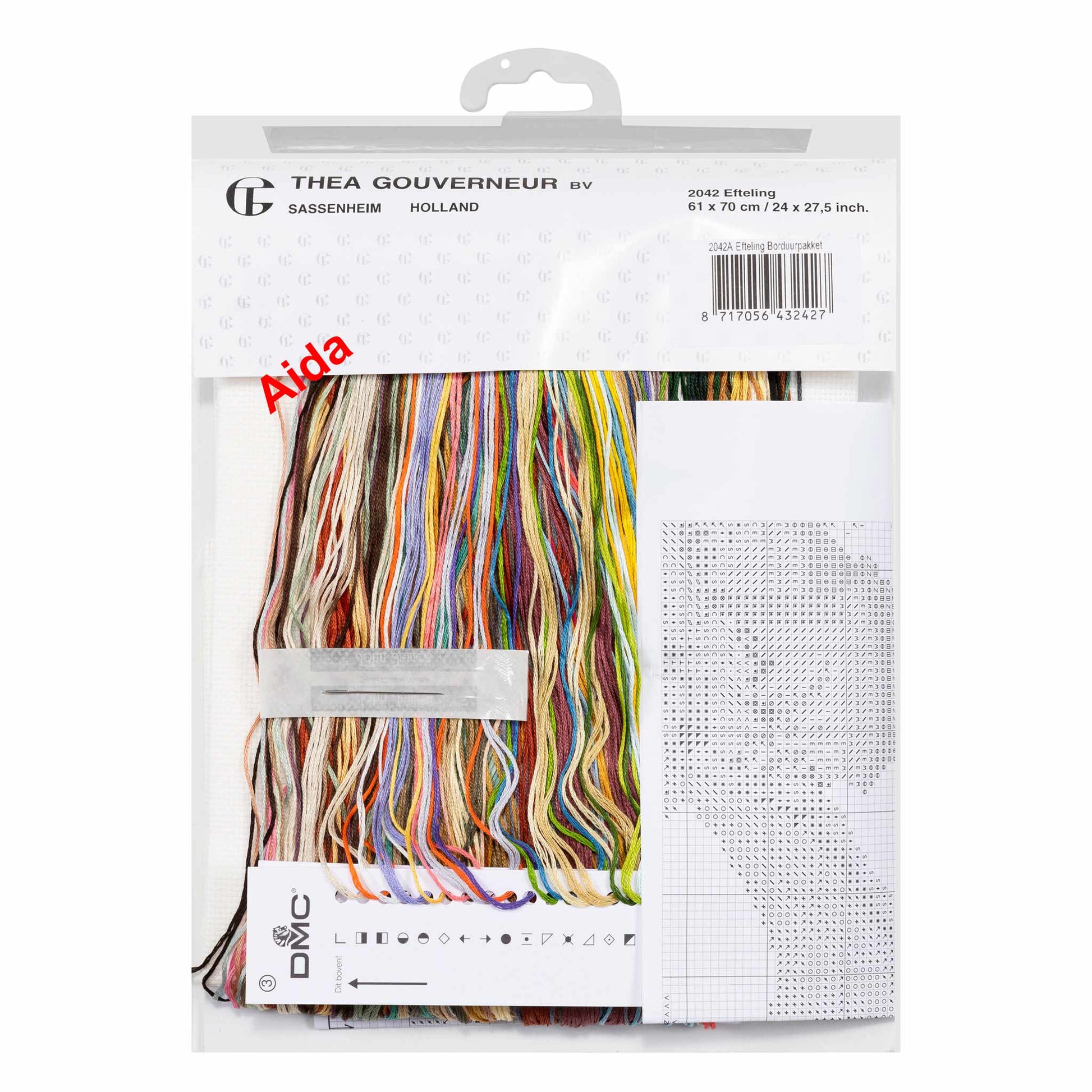 Packaged embroidery kit with colorful threads and aida fabric on a white background