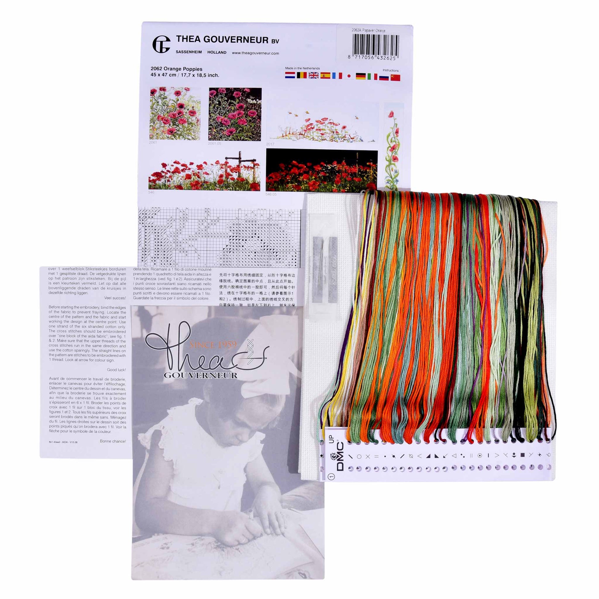 Embroidery kit with pattern and chart, needlework fabric, and threads on a white background