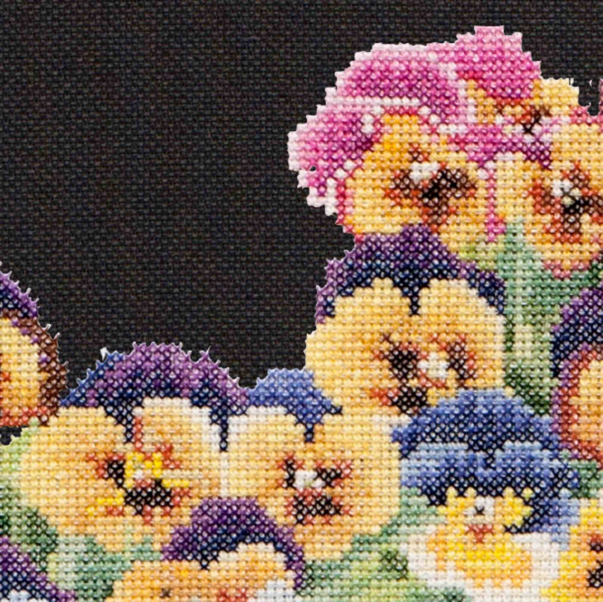Cross stitch mockup of colorful pansies flowers