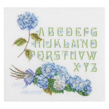 Cross-stitched pattern with blue hydrangeas and a floral alphabet on a white background