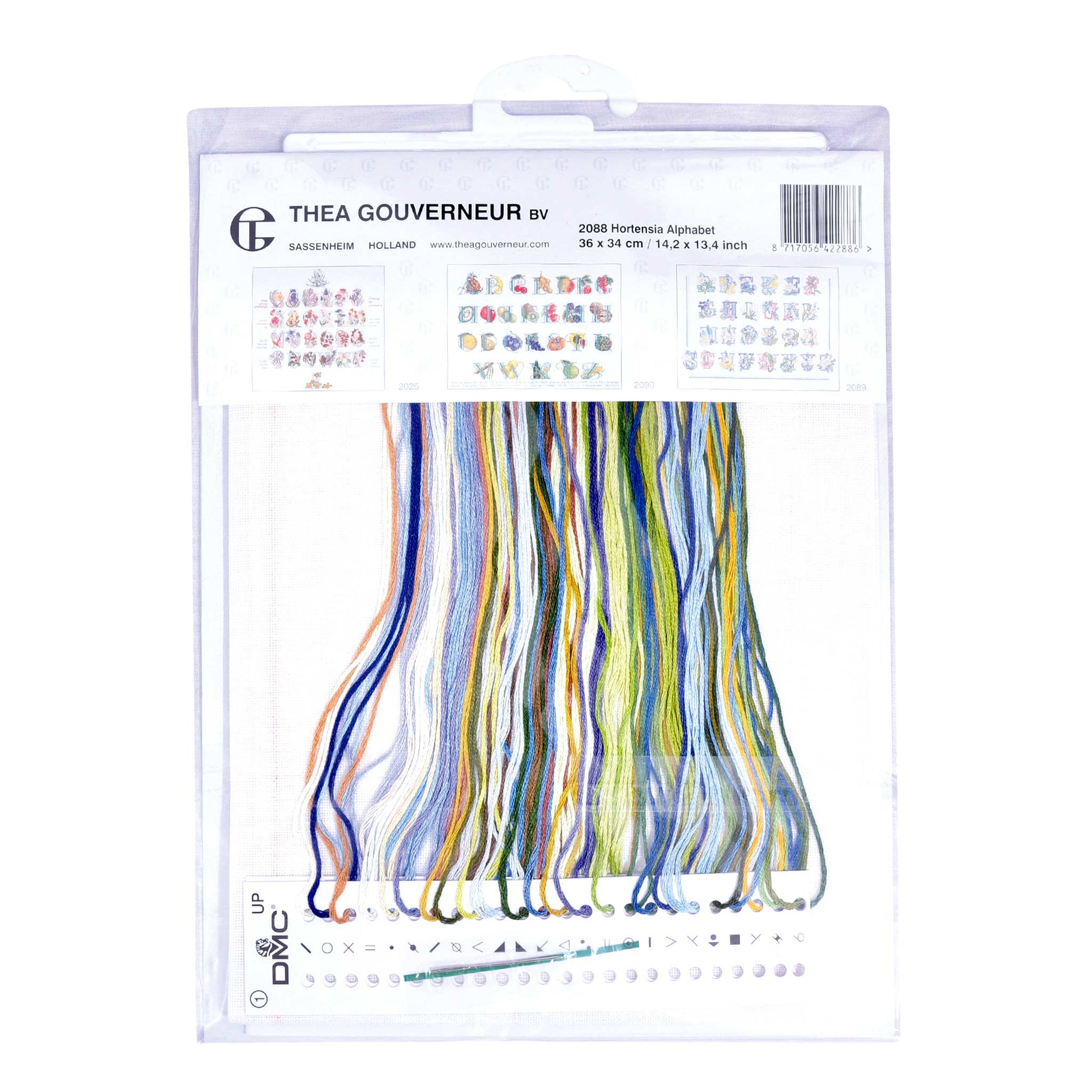 Cross-stitch kit packaging with fabric and threads on a white background