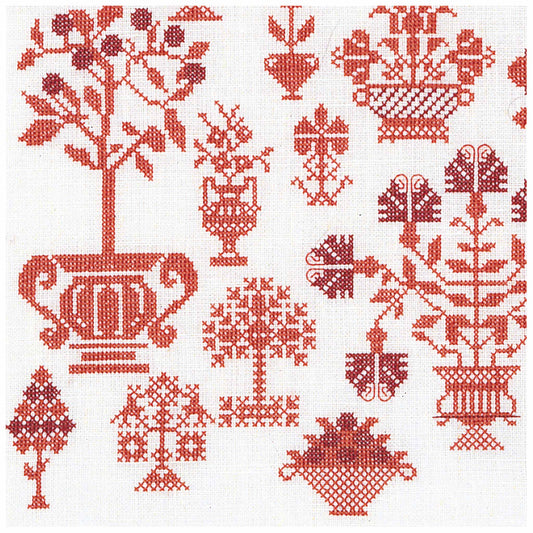 Cross stitch  pattern with red floral and geometric designs on a white background sample