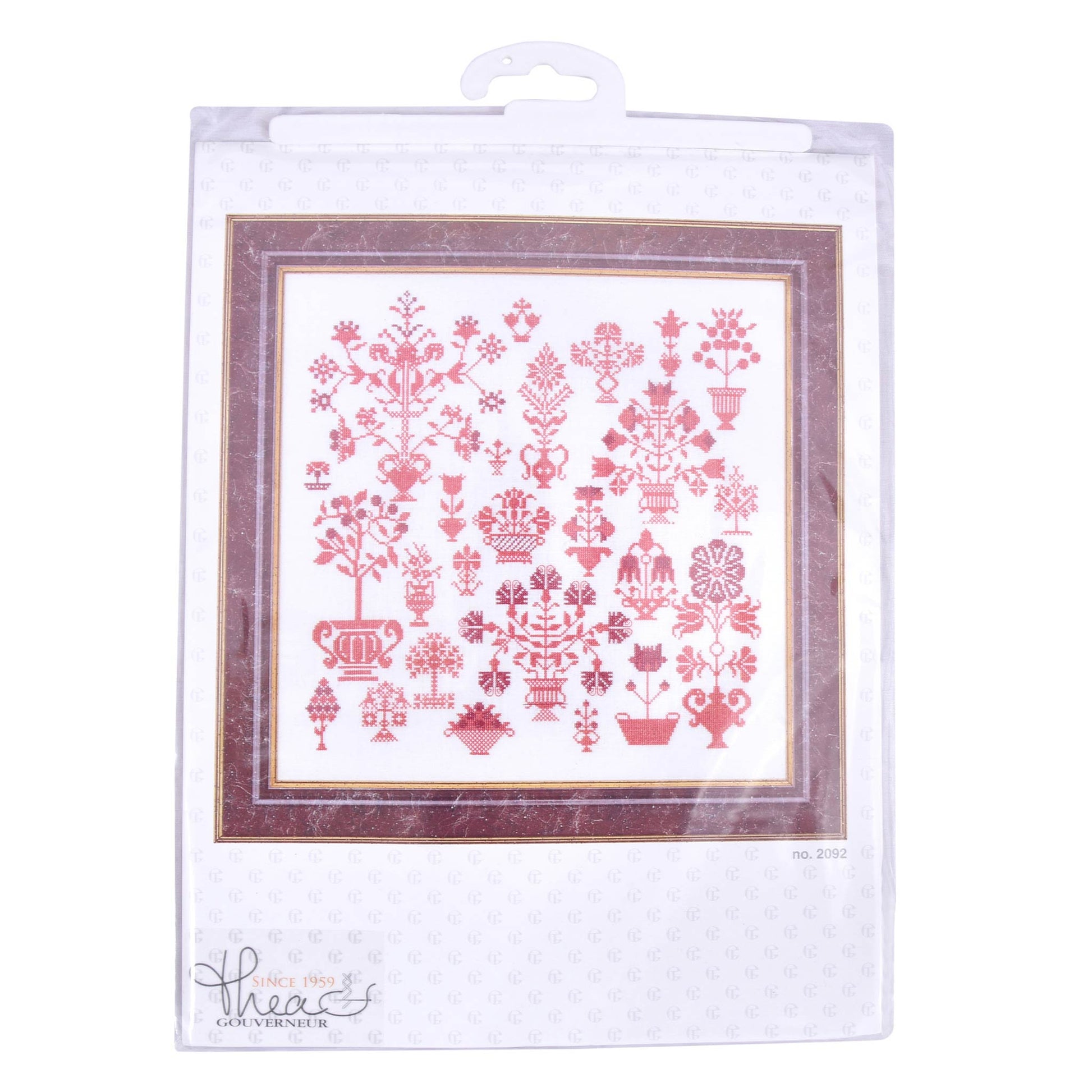 Packaged cross-stitch pattern with red design sample Thea Gouverneur