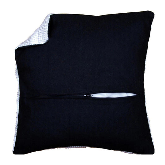 Black pillow with a zipper on a white background