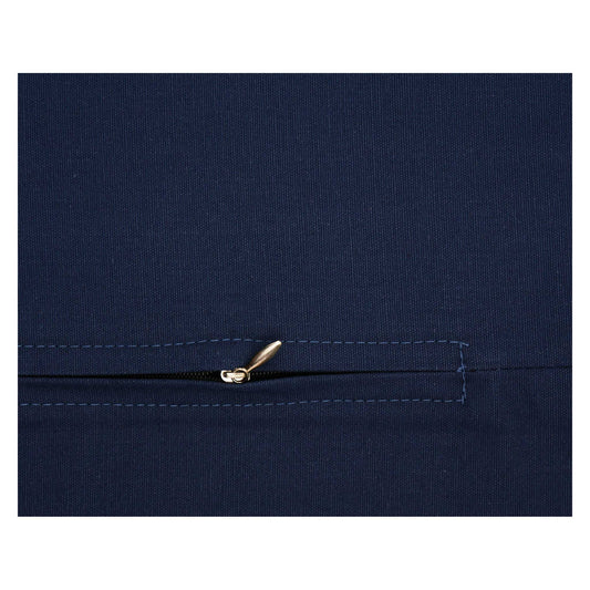 Close-up of a navy blue fabric with a zipper on a white background