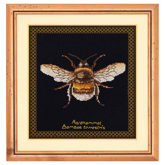 cross-stitched bee on a honeycomb pattern