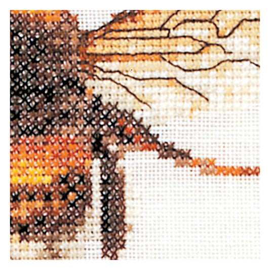 Close-up of a cross-stitched bee with orange, black, and white colors on a white background.