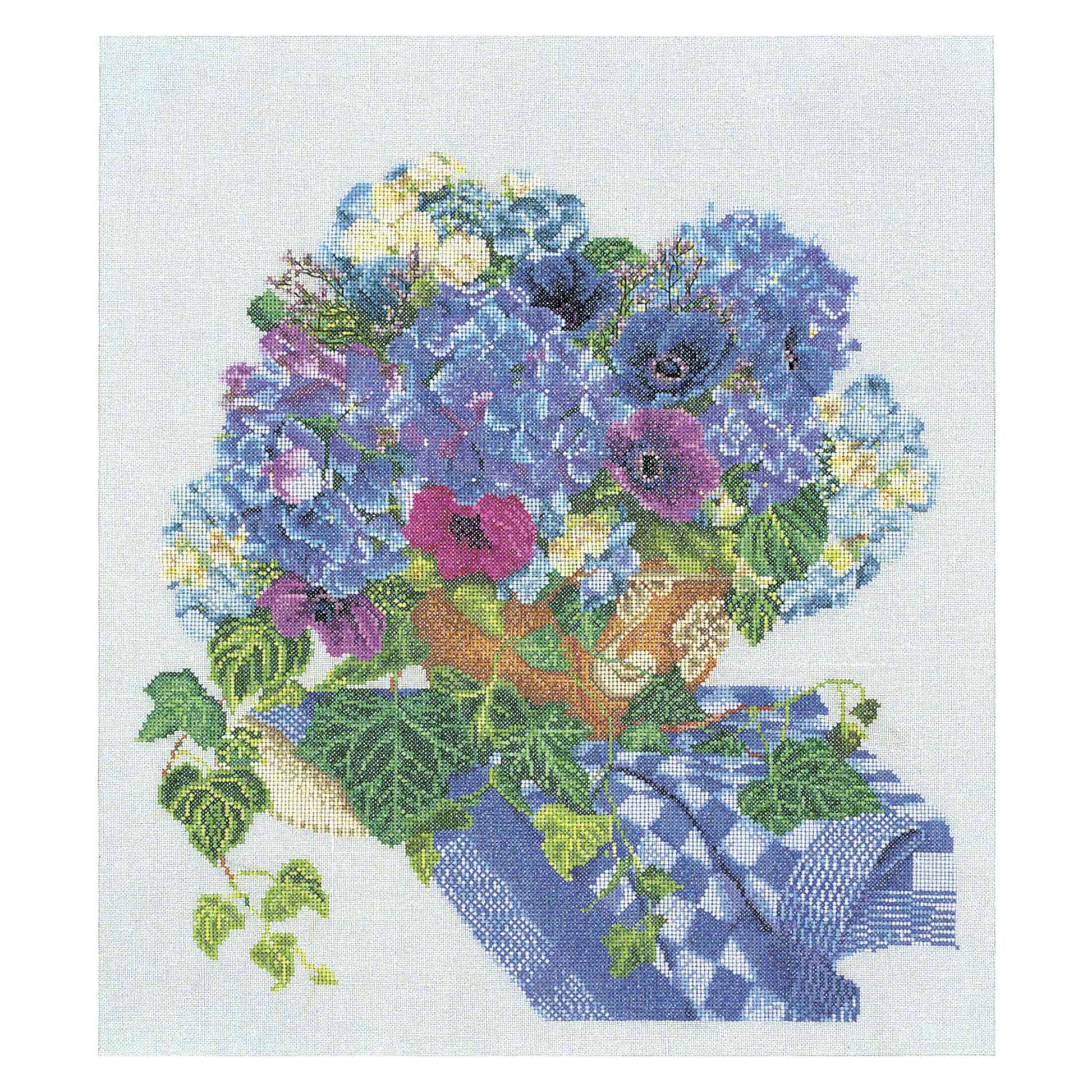 Cross-stitched design of a bouquet of flowers with a blue checkered cloth on a white background