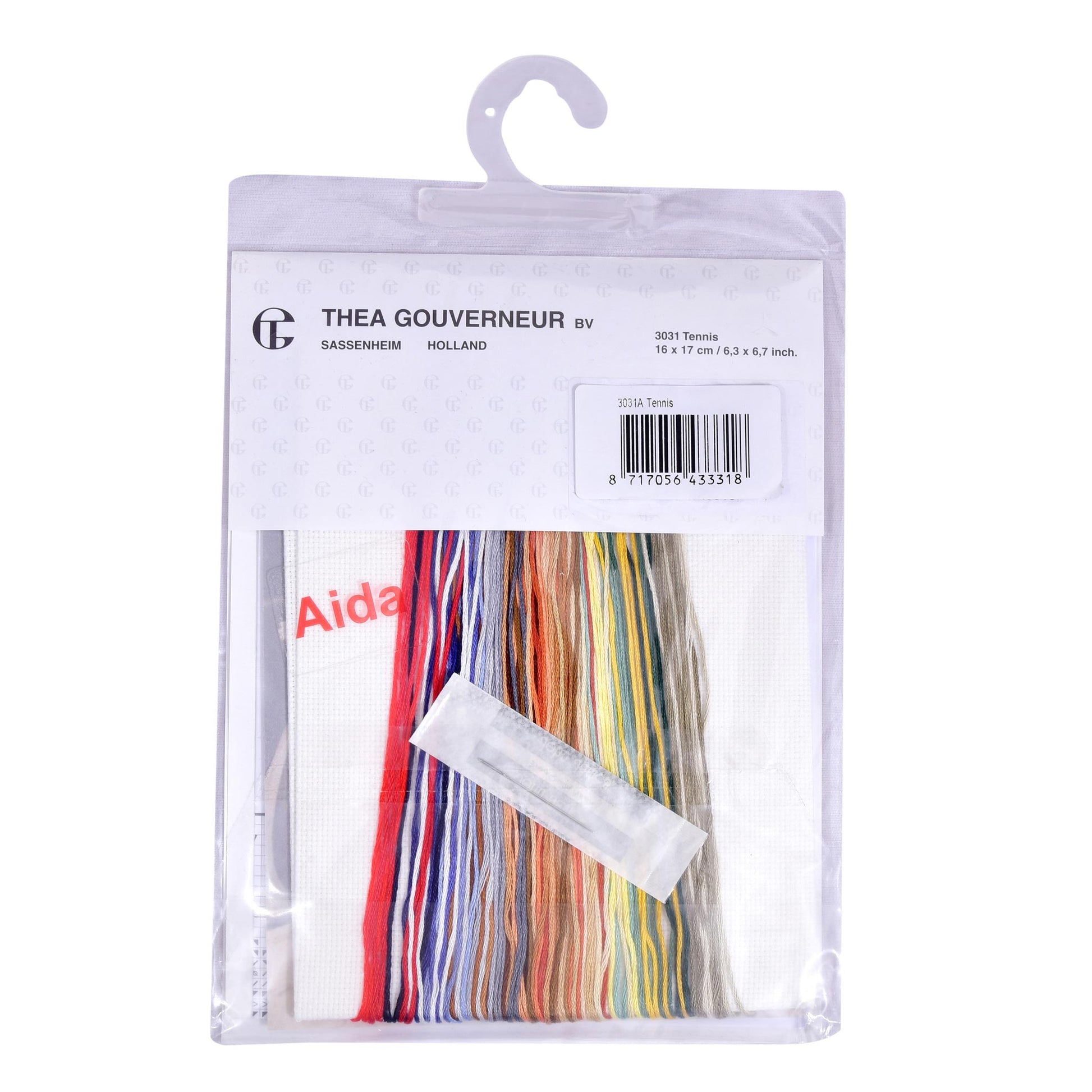 Embroidery kit packaging with cross-stitch threads and pattern chart on a white background