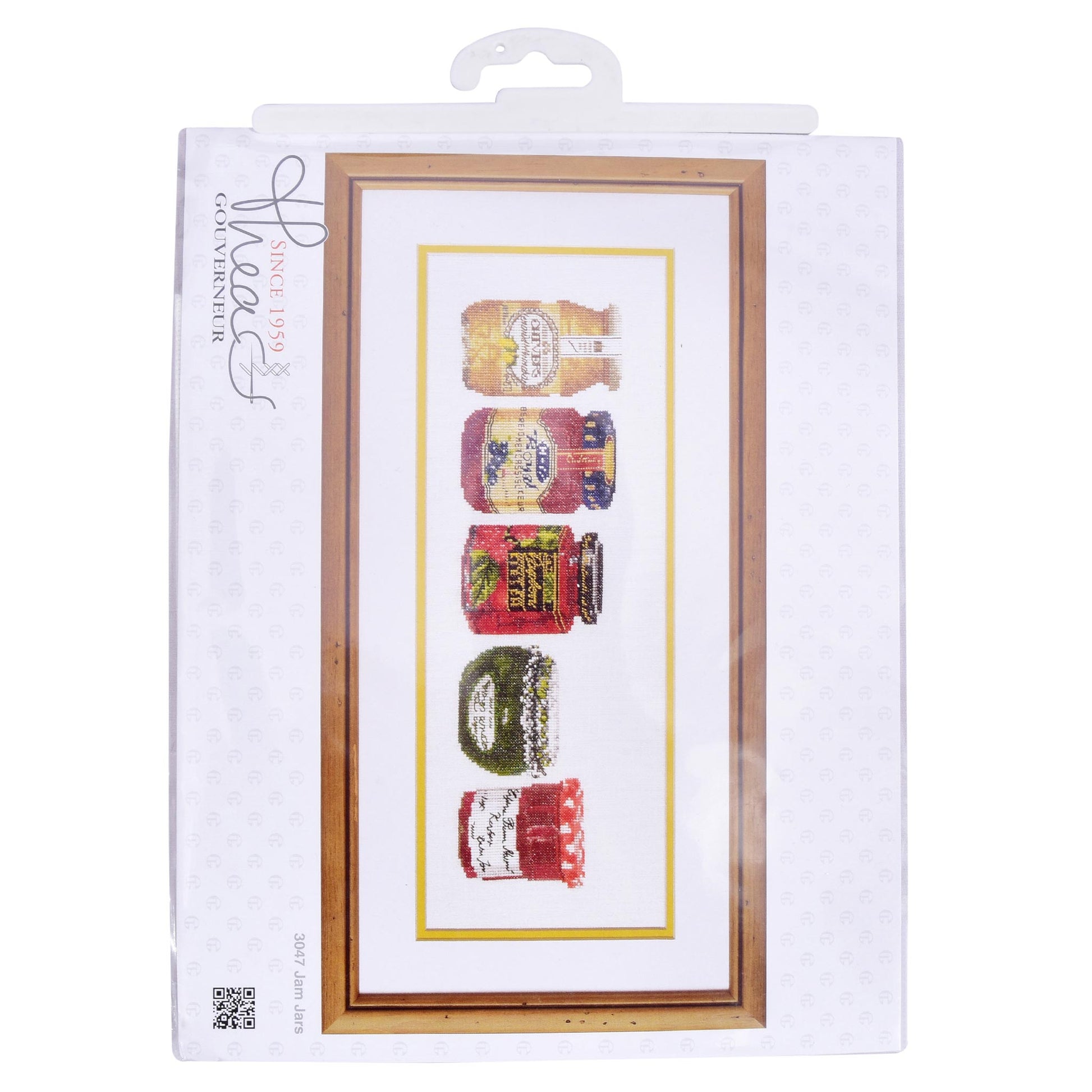 Packaged cross-stitch kit with four colorful jars on a white background Thea Gouverneur