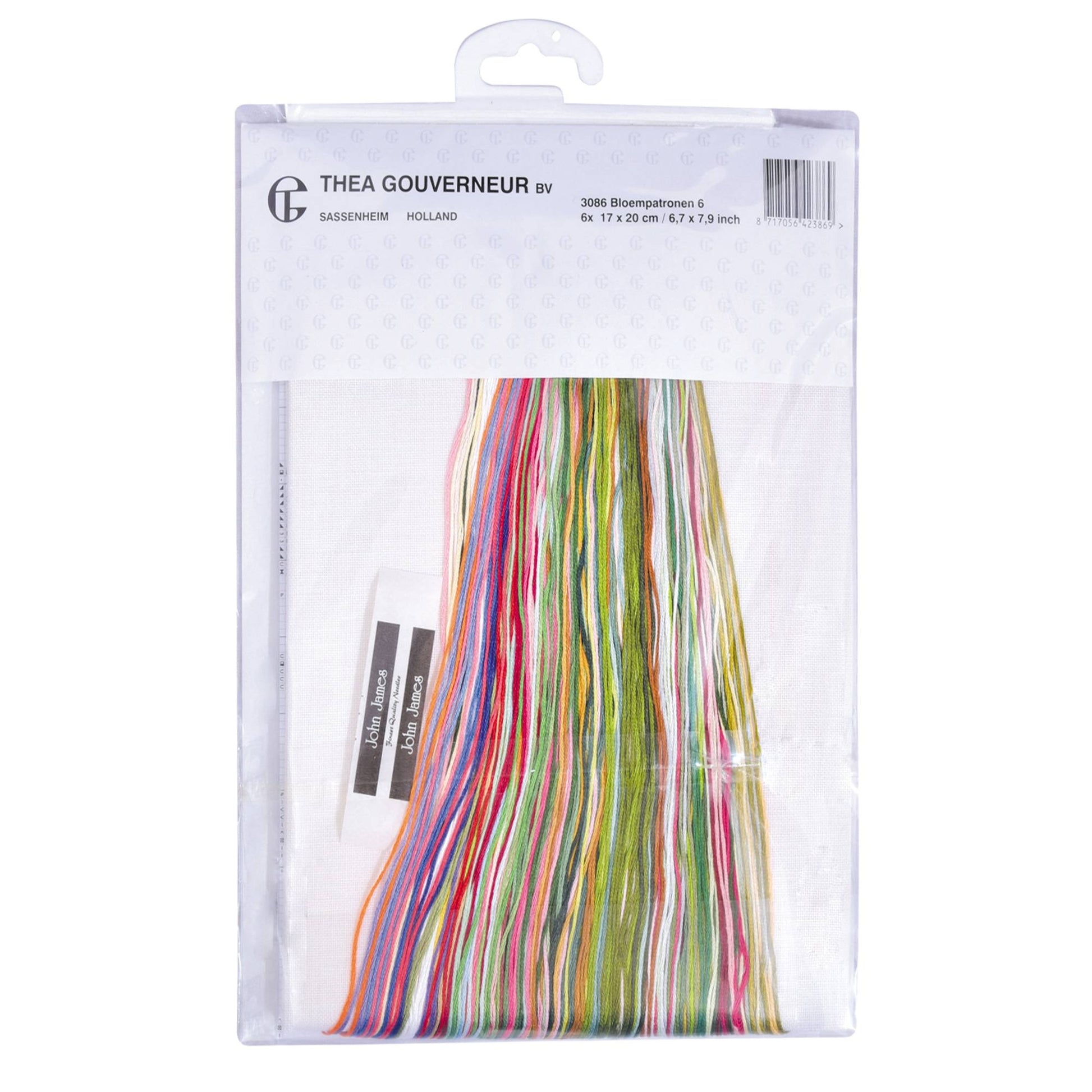 Packaged embroidery floss with colorful strands, embroidery needle and needlework fabrics