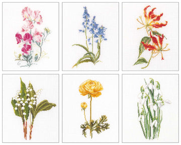 Set of six cross-stitch patterns of various flowers on a white background