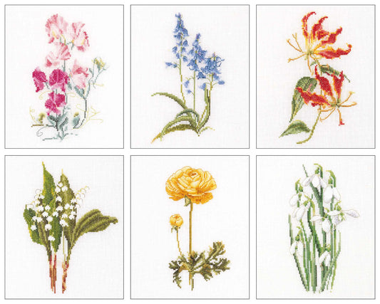 Set of six cross-stitch patterns of various flowers on a white background