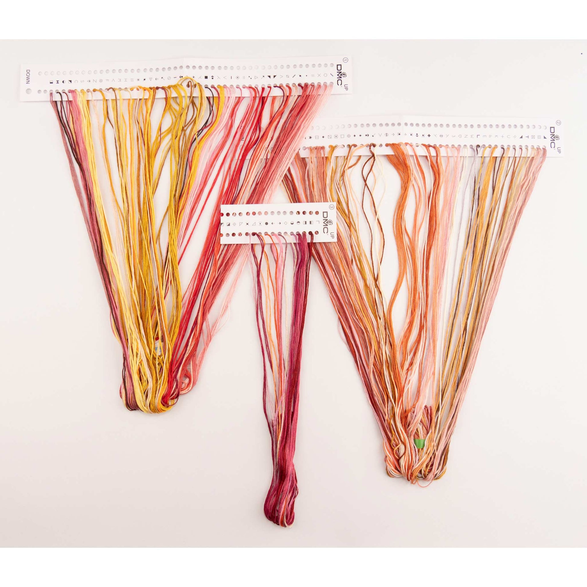 Set of colorful dmc embroidery threads presorted on the floss organizer