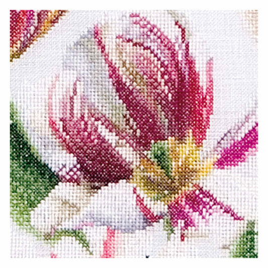 Cross-stitched floral design with pink, yellow, and green colors on a white background
