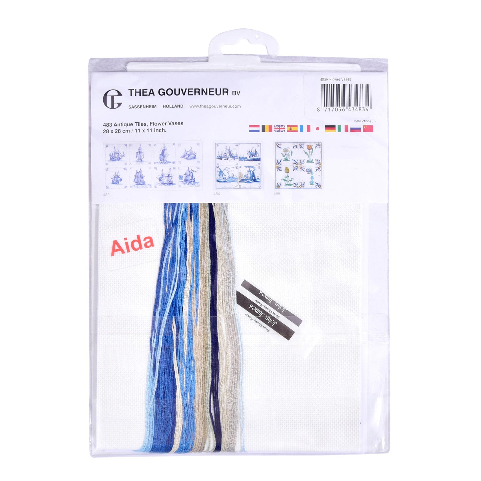 Embroidery kit with Aida needlework fabric and packaging displaying dmc embroidery threads and kit content