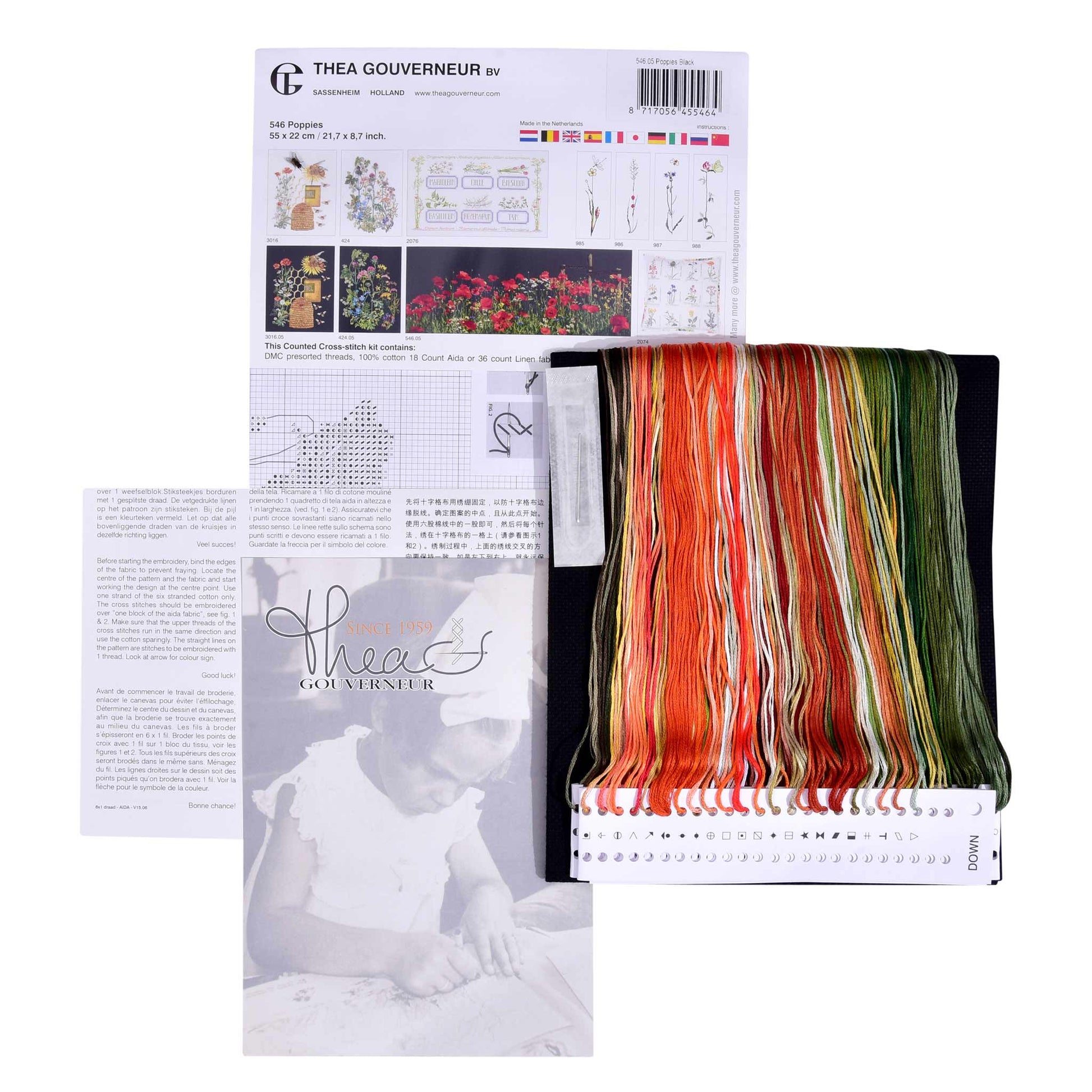 Embroidery kit with pattern and chart, needlework fabric, and threads on a white background