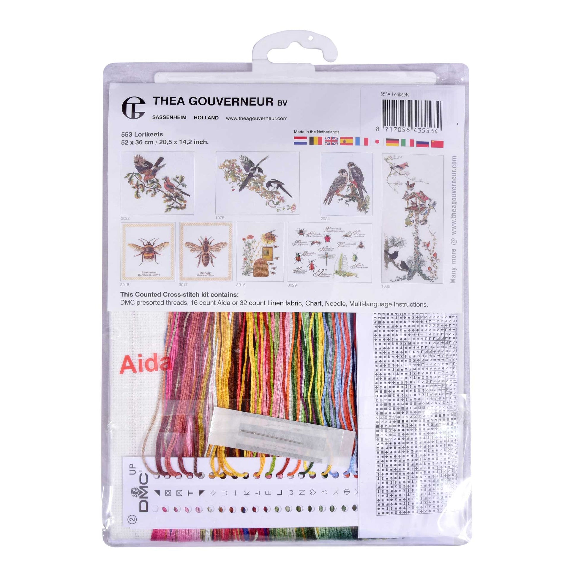 Thea Gouverneur cross-stitch kit packaging with colorful threads and embroidery tools on a white background