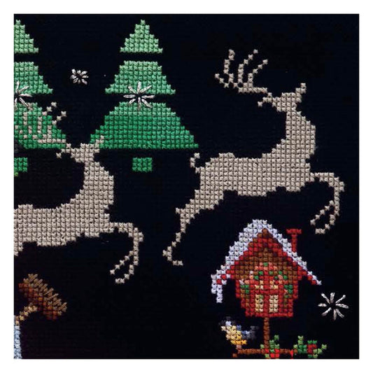 Cross-stitched design featuring reindeer, a cabin, and trees on black fabric.