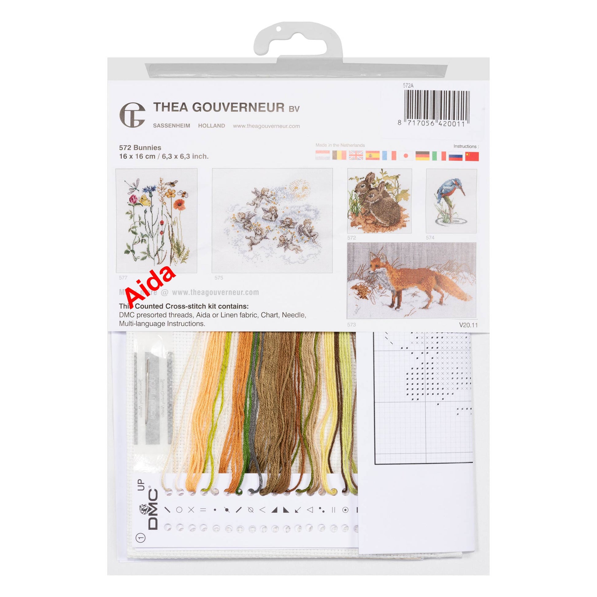 Cross-stitch kit packaging with embroidery threads and patterns chart