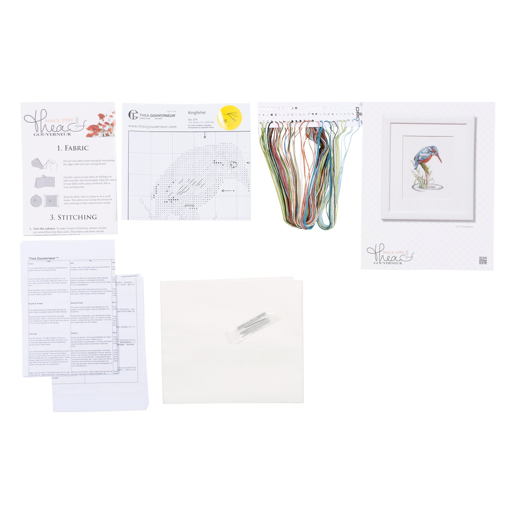 Embroidery kit with pattern sheet, fabric, and threads on an floss organizer