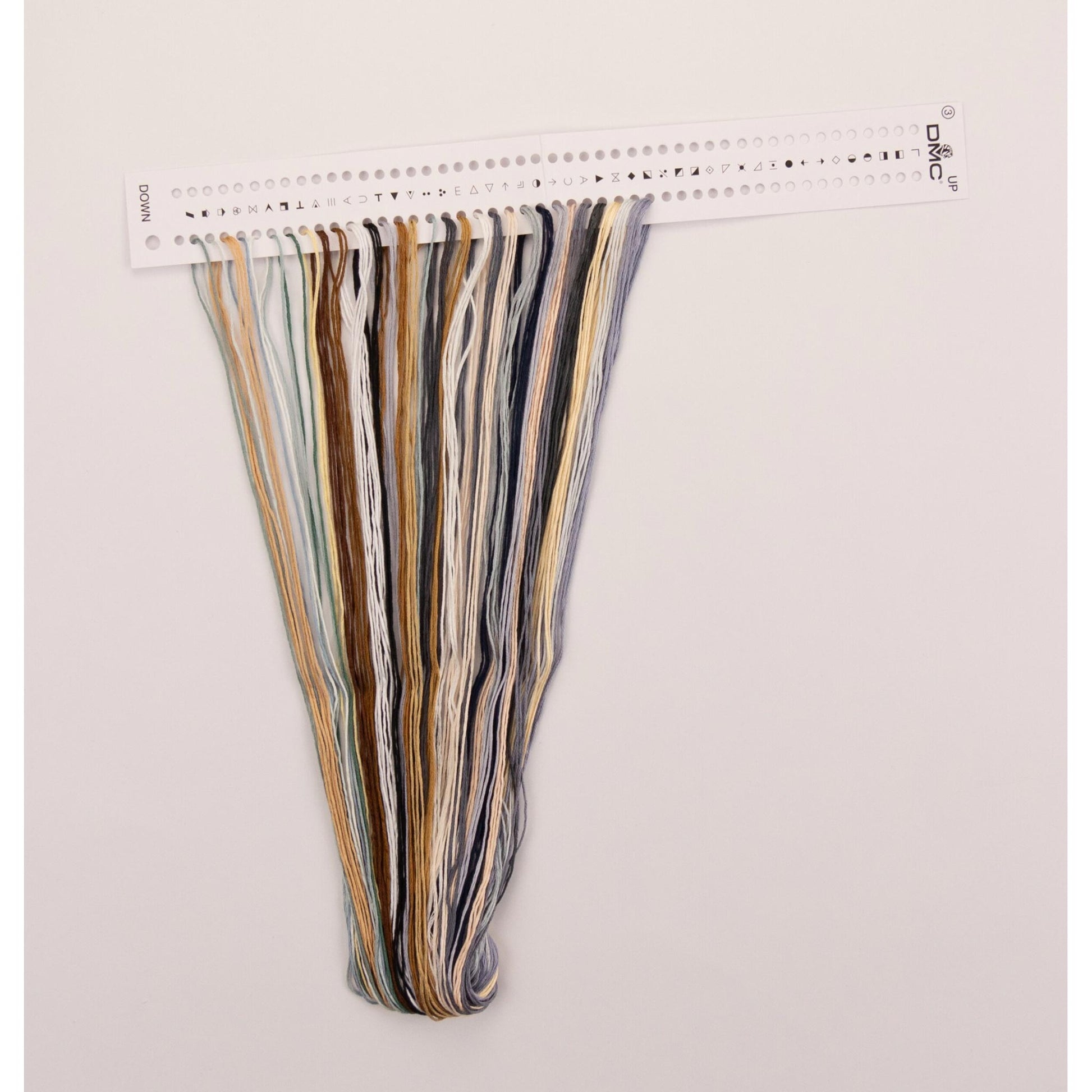 Set of colorful dmc embroidery threads presorted on the floss organizer