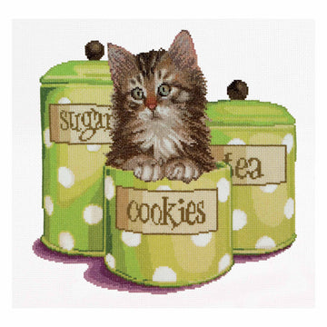 Cross-stitched design of a kitten sitting on green polka dot cookie jars with 'Cookies' label.