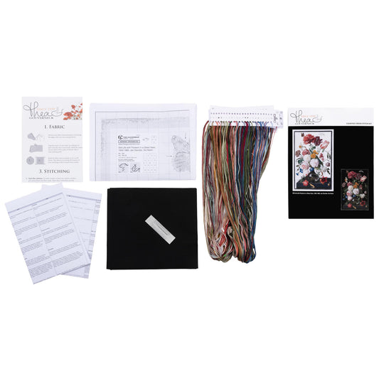 Collection of embroidery supplies including needlework fabric, threads, and instructions on a white background
