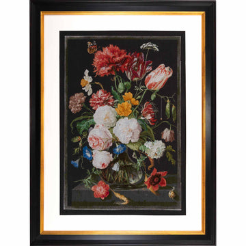 Framed cross stitchof a still life with flowers in a vase on a dark background