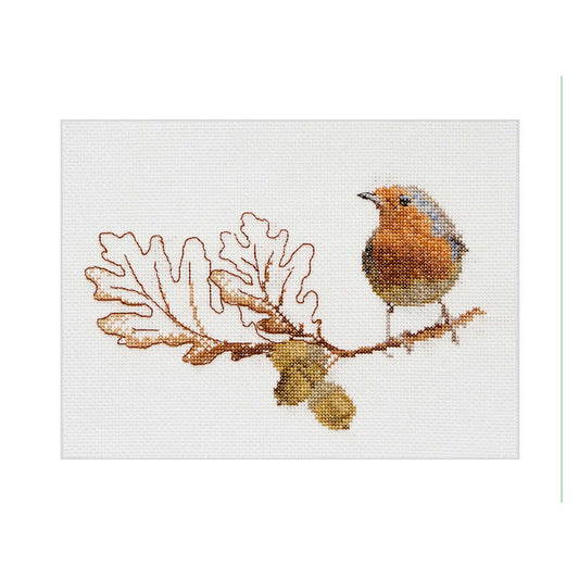 Cross stitched design of a robin on a branch with leaves