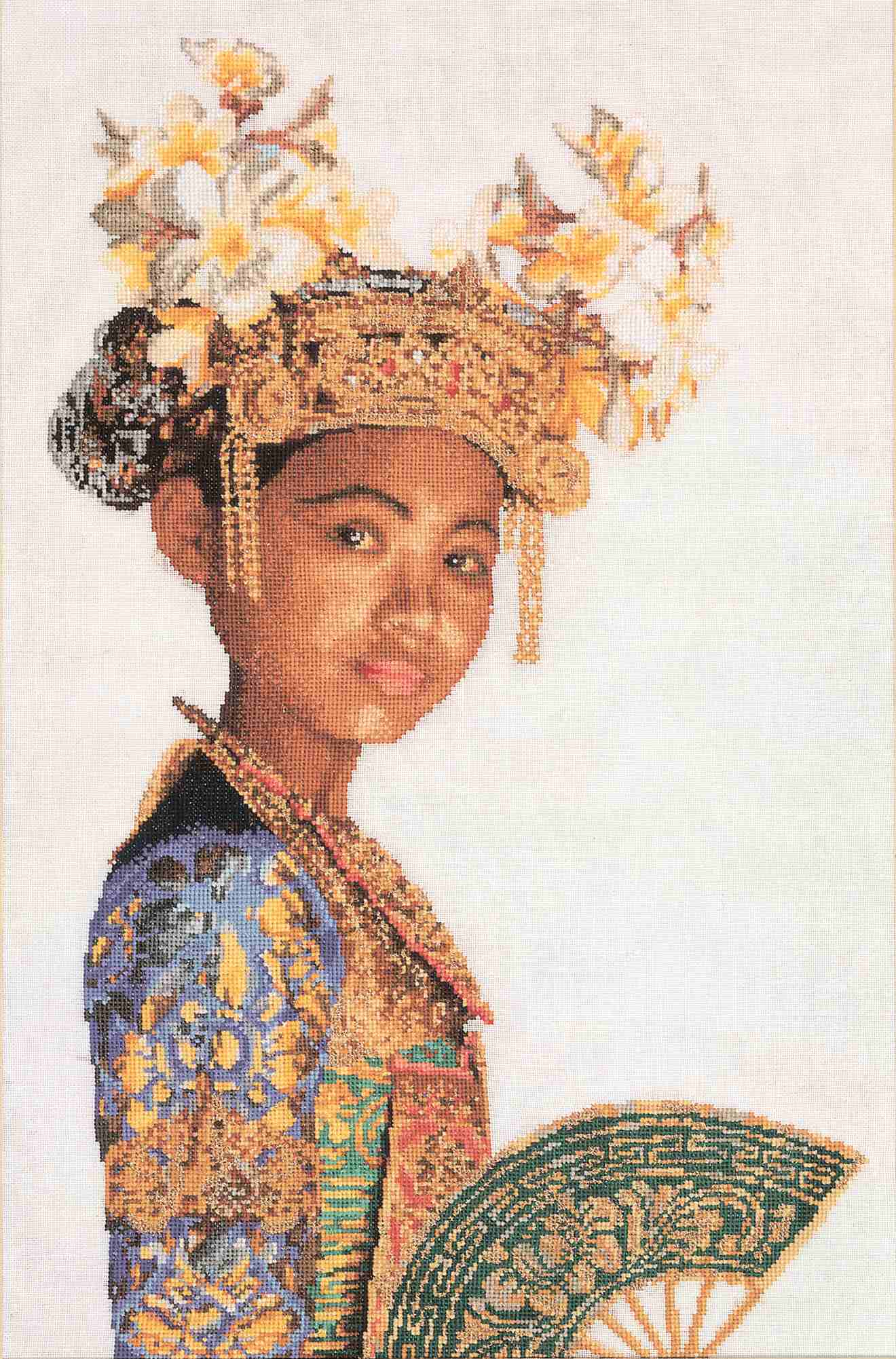 Traditional costume with intricate headpiece and fan cross stitch design