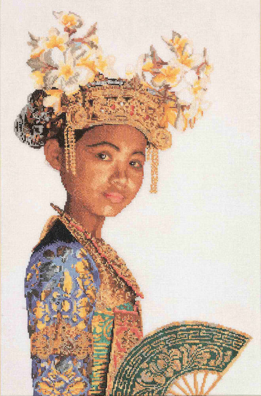 Traditional costume with intricate headpiece and fan cross stitch design