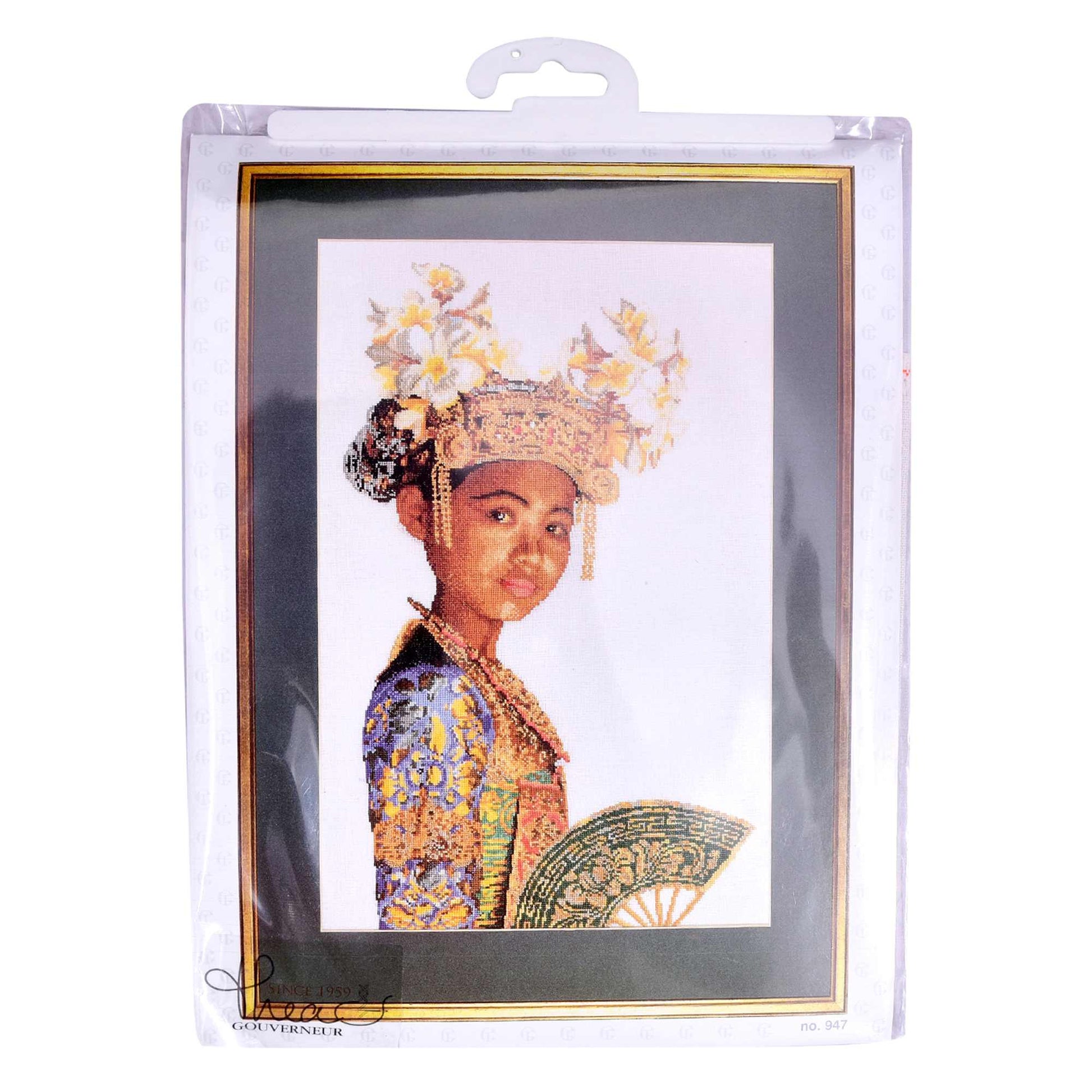 Cross stitch a person in traditional attire with a decorative headpiece and fan, in packaging.