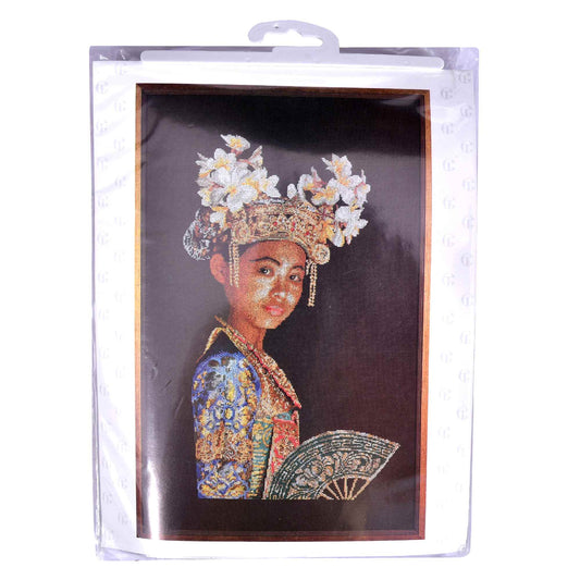 Packaged cross stitch kit of a person in traditional attire with a decorative headpiece and fan.