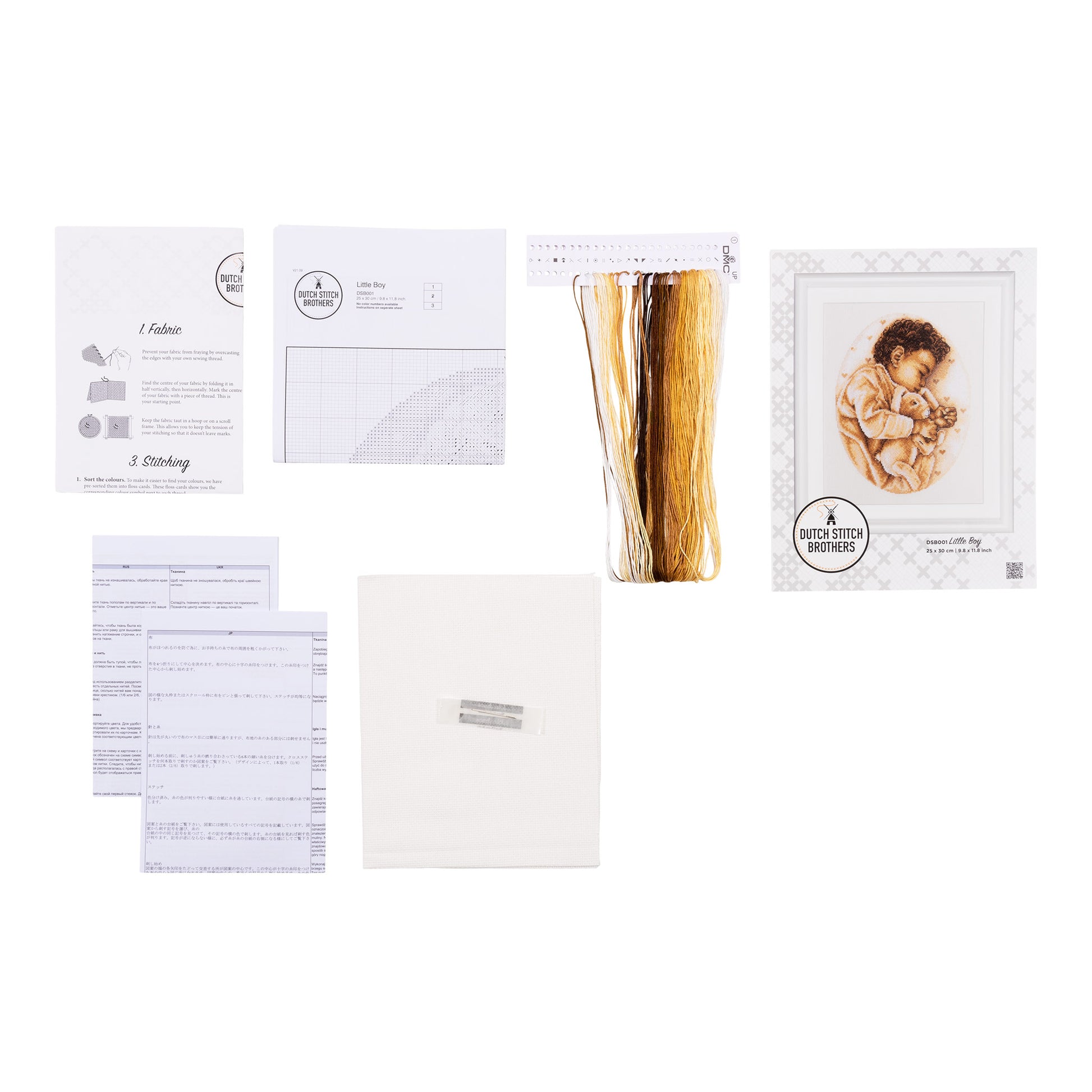 Embroidery kit with pattern and chart, needlework fabric, and threads on the floss organizer.