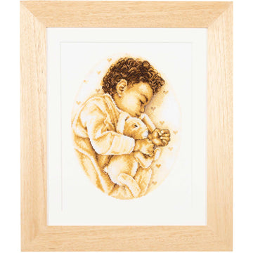 Cross stitch kit of a child holding a rabbit on a white background