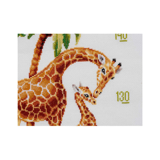 Cross-stitch pattern with two giraffes on a white background close up