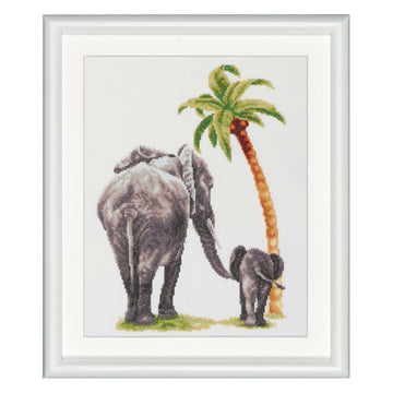 Framed cross-stitch design of two elephants and a palm tree on a white background