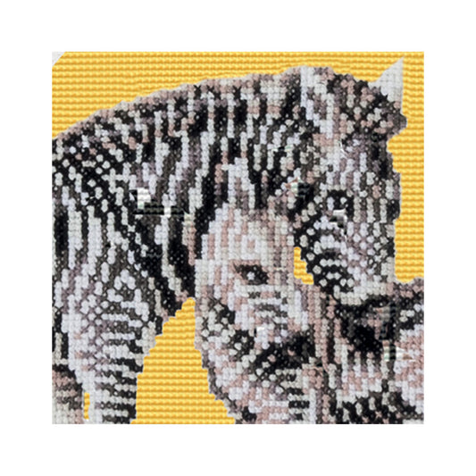 Cross-stitched zebra design on a yellow background