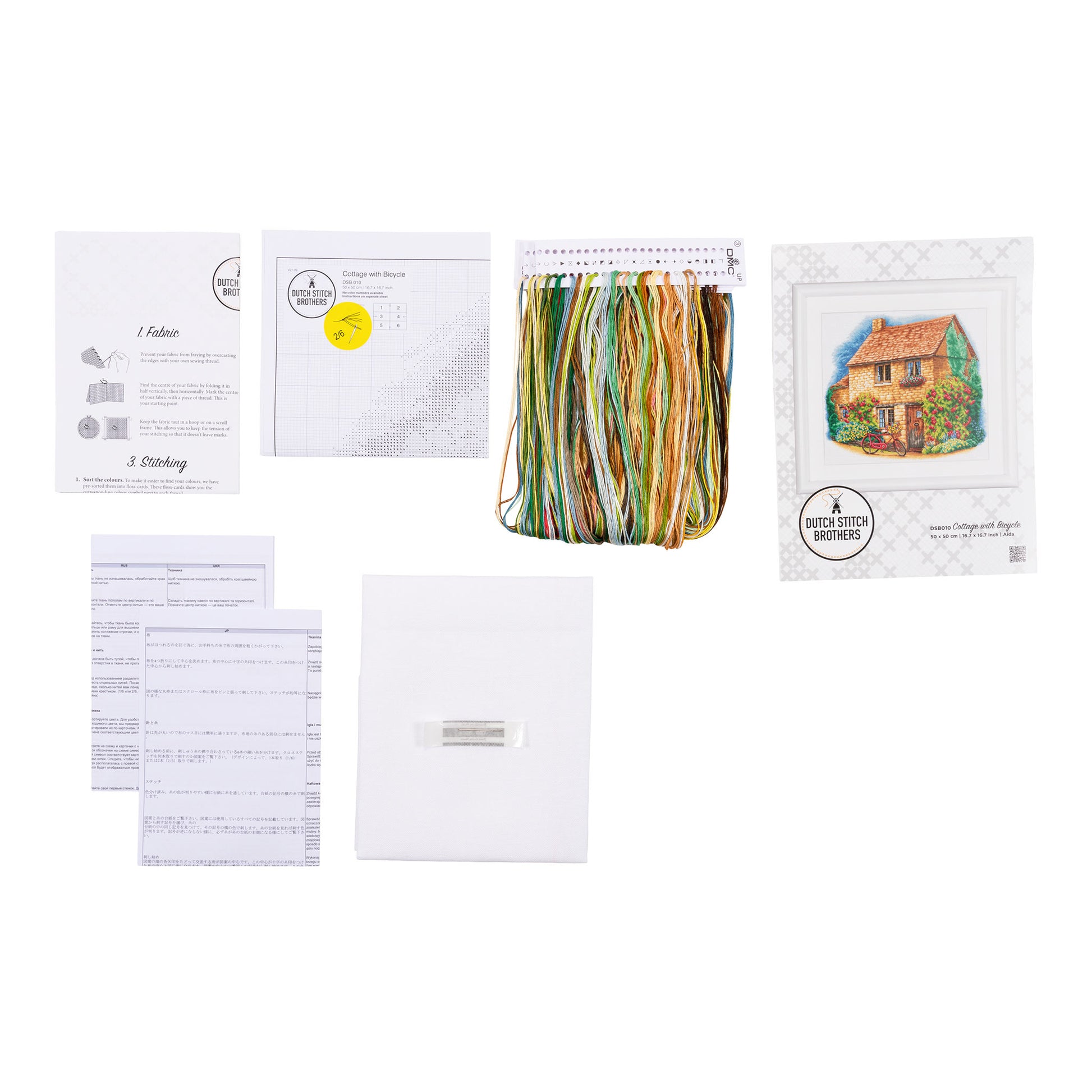 Embroidery kit with pattern and chart, needlework fabric, and threads on the floss organizer.