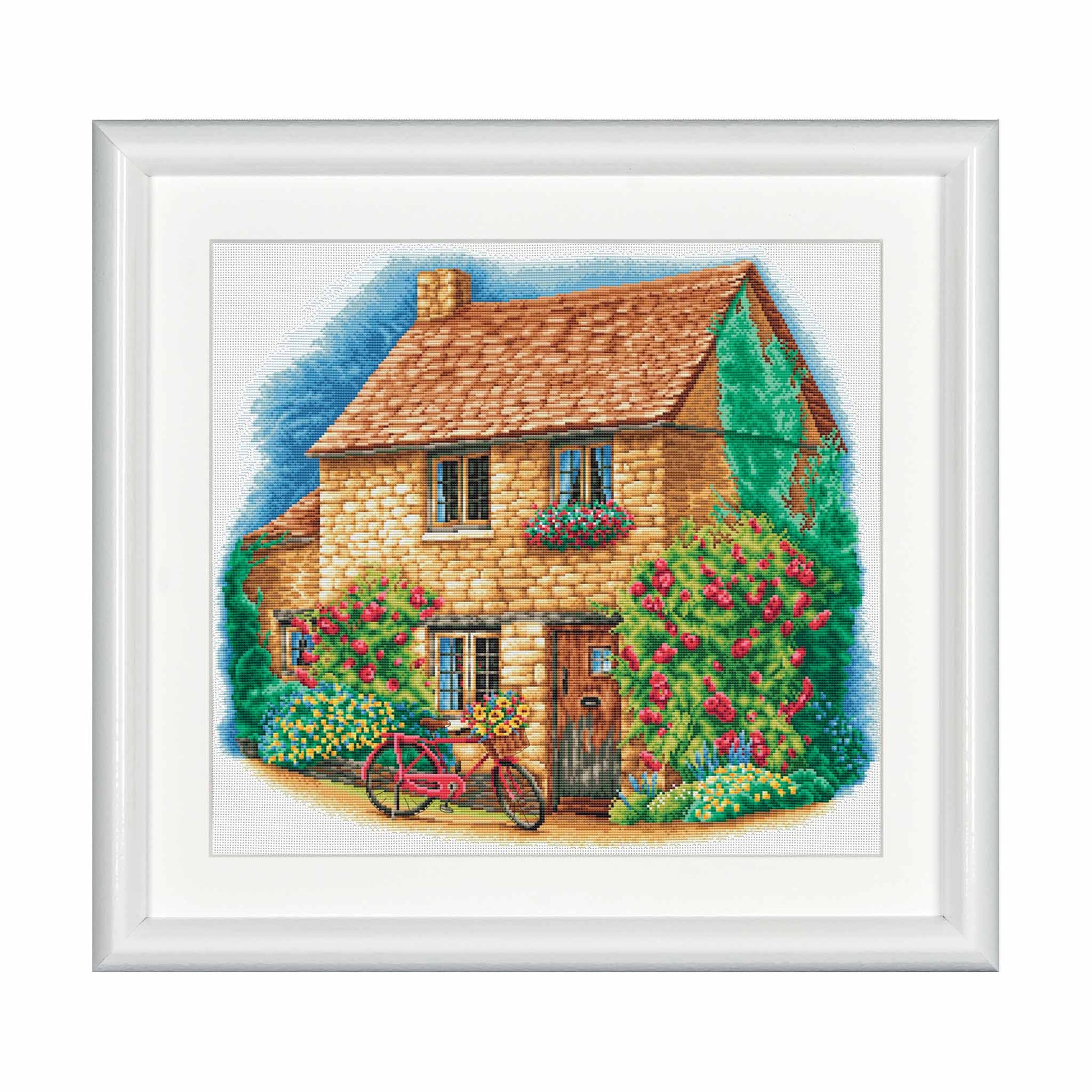 Cross stitch design of a quaint cottage with a bicycle in front, surrounded by flowers and plants.