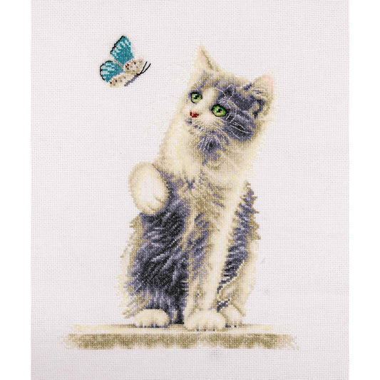 Cross-stitched design of a cat and butterfly on a white background