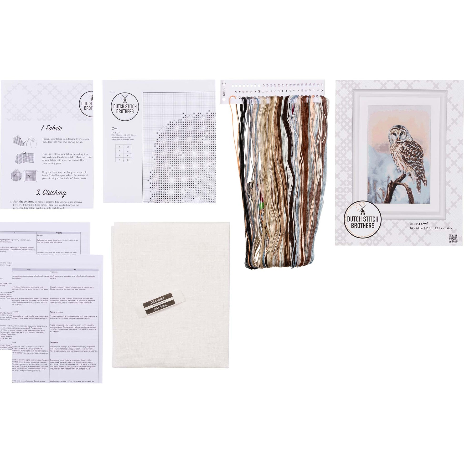Embroidery kit with pattern and chart, needlework fabric, and threads on the floss organizer.
